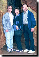 Family by a redwood tree.