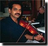 Rupesh plays the violin for Zehra's birthday.