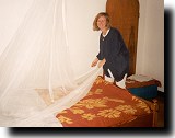 Jane explains how to spread the mosquito net